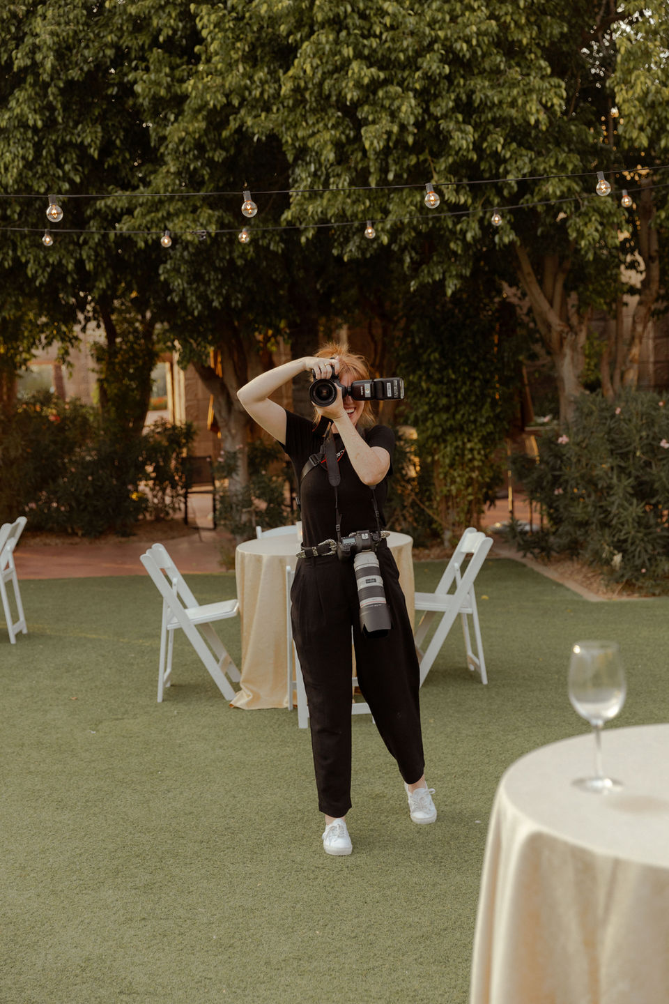Gillian Rea photographing candid moments at a wedding cocktail hour, showcasing editorial wedding photography Arizona and timeless wedding photos