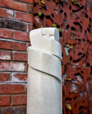 'Hug', 23" -
2024, Portland stone - Jan Bruce Sculpture. In-situ in customer's garden.