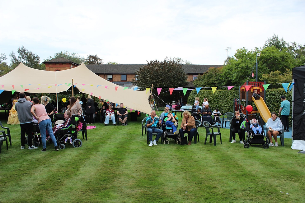 Children and families enjoying the Family Fun Day at Francis House.