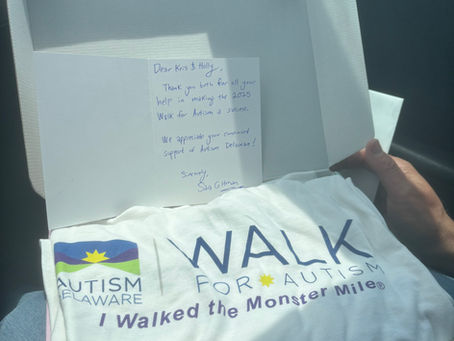 Kris & Holly received shirts from Autism Delaware for their participation in this year's 5K