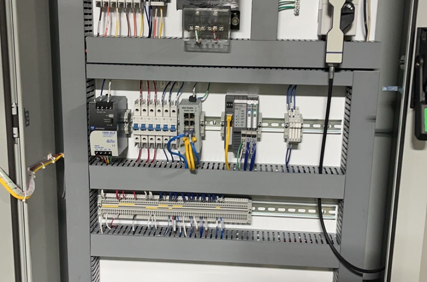 Commercial electrical control cabinet with breakers, wiring, and automation components