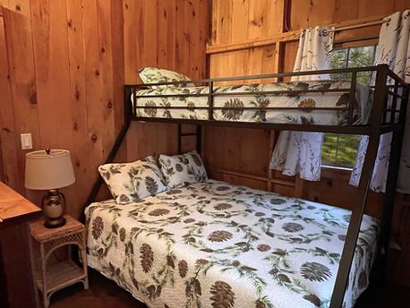 Second bedroom has a bunk twin over queen.
There is a side-table and lamp with built in charging ports and night light.