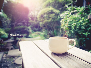 mug-on-wooden-table-in-garden.jpg