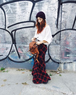 Season of the tartan skirt is upon us. Amidst a sea of Brooklyn graffiti, of course