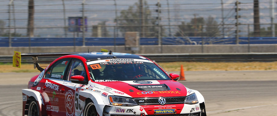 San Ramon, CA – Finally Reto Baumann was able to get back in the driver seat. Practically the first time this year that he was able to wheel the #53 Volkswagen Jetta 2.0 GLI powered by 034Motorsport. And Auto Club Speedway at Fontana, CA is a track he doesn’t have that much experience on. It provides a unique and super-fast challenge with using the NASCAR oval banking for T1 and T2 which are taken at around 145mph flat… Your brain surely tells you one thing, but your right foot must stay planted firmly to the bottom of the accelerator and you trust your car and the physics to make if through. You don’t have that on any of the other tracks in California.