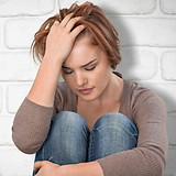 a-young-teenage-woman-sitting-on-the-gro