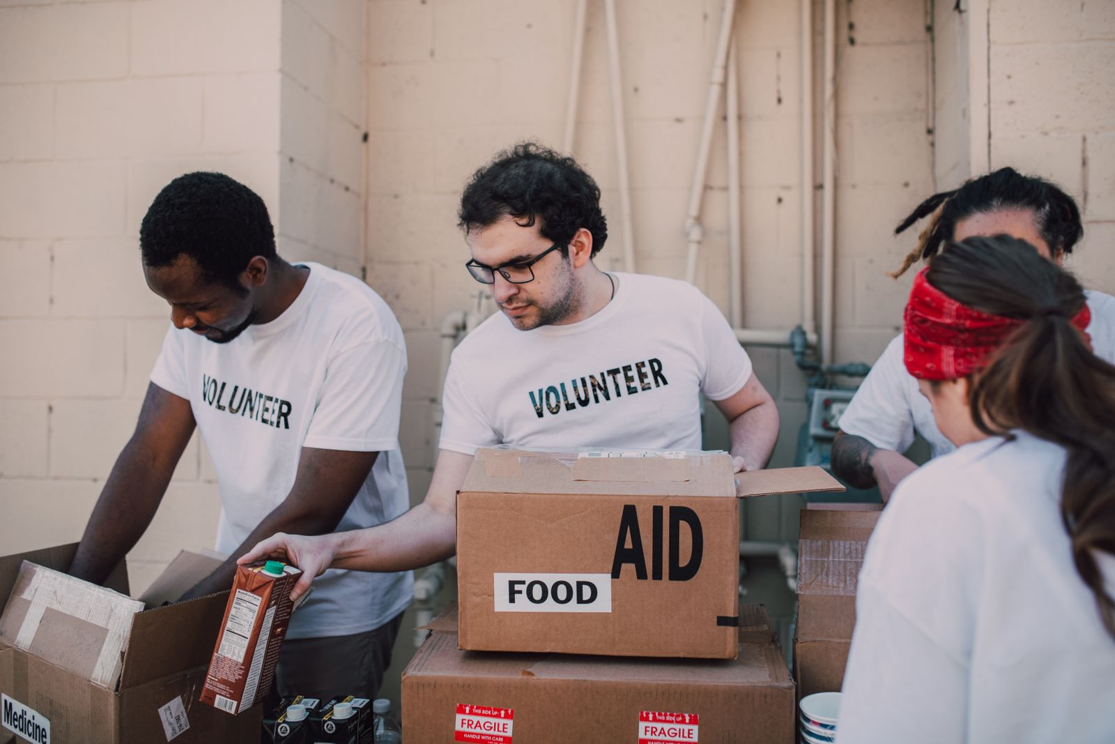 Volunteers packing food boxes
