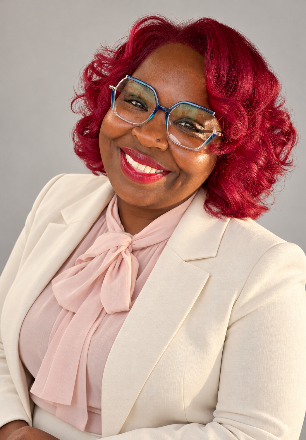 Diana Johnson in an ivory blazer and blush bow blouse