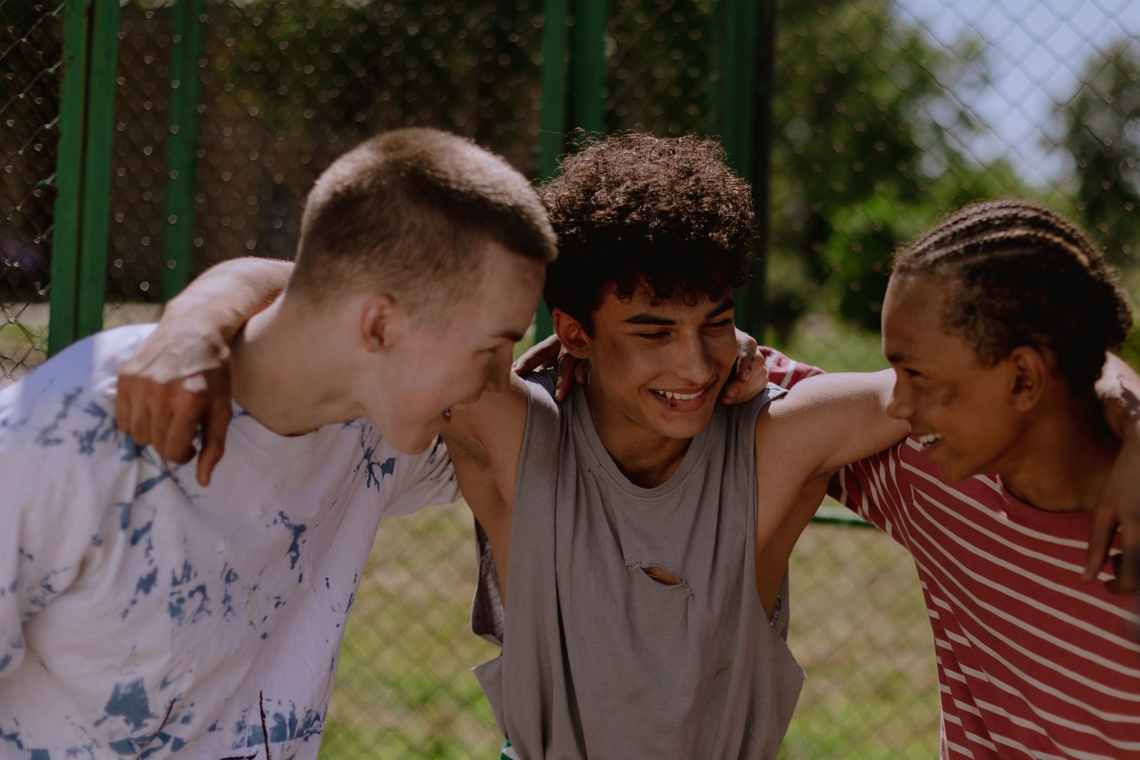 Teenagers laughing together outdoors
