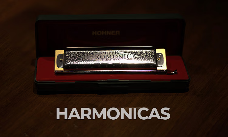 Harmonica in an open red case on a wooden surface, with "Hohner" and "Super Chromonica" engraved. Text below reads "Harmonicas."