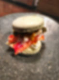 Special made dessert that is macaroon with uni, caviar, cream and crab