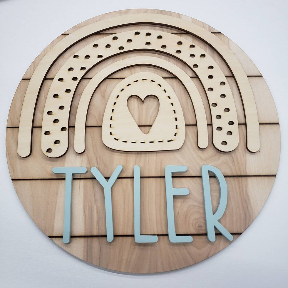 Thumbnail: Wooden rainbow sign with Tyler's name