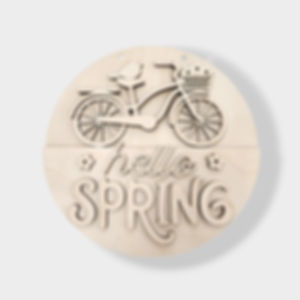 Round spring wood sign: bicycle, 'hello spring'
