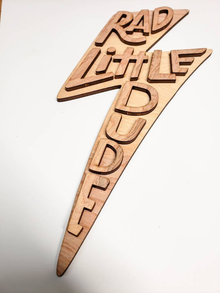 Thumbnail: Wooden lightning bolt sign: "Little Dude"