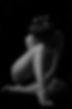 black-white-shot-naked-young-woman-sitting-floor-posing.jpg