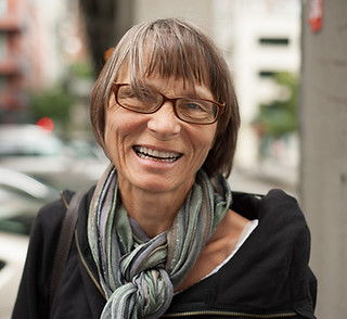 close-up-portrait-senior-woman-wearing-muffler-harbor