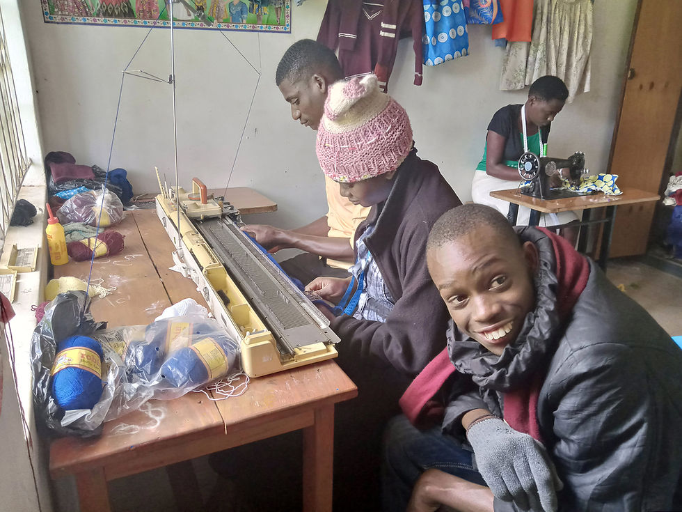Students learn how to use a knitting machine