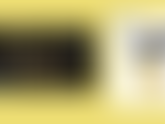 A golden background highlighting Majesty's Midweek Quiz - Live Aid
