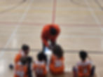 Coach David drawing plays during a game