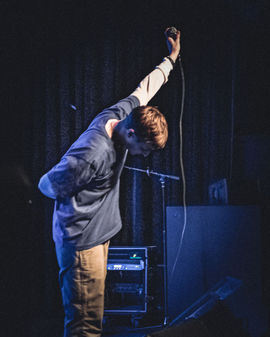 Dylan Owen performing on tour