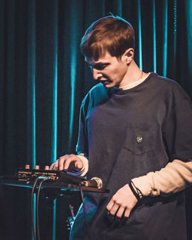 Dylan Owen performing on tour