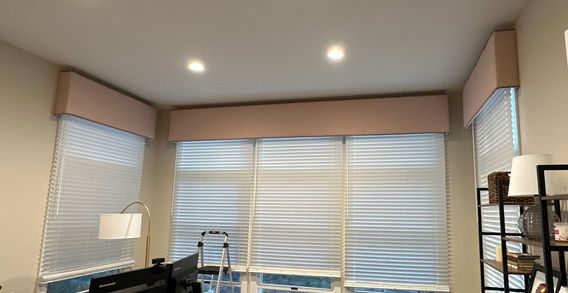 Custom rose cornice boards with matching braided trim installed in a designer office, crafted by Rideaux Designs