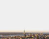 Aerial view of Auckland city with numerous buildings, including a prominent skyscraper, showcasing urban property management