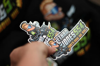 a person is holding a sticker that says " that 's how we roll "