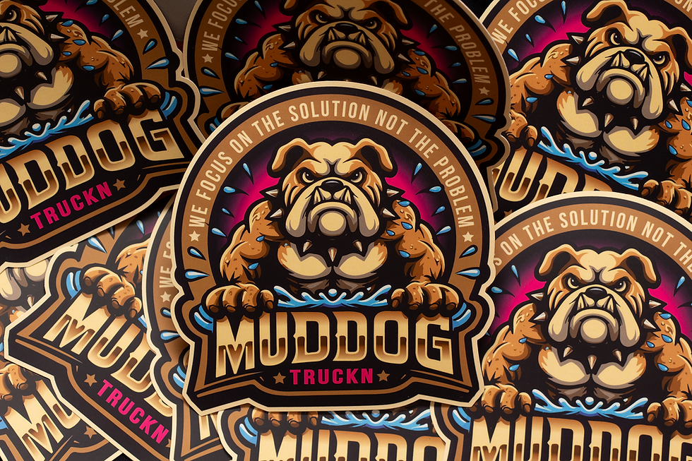 Pile of circular stickers with fierce bulldog illustration and text "MUDDOG TRUCKN." Bold colors, slogan "We focus on the solution."