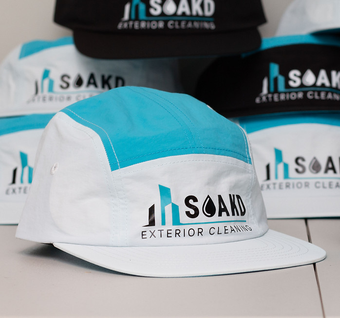 Finished SOAKD five-panel cap with turquoise panels and front logo