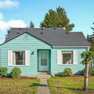 Green and blue house in everett washington flipped by ireland homes  