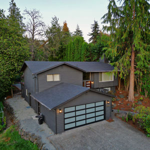 Black Homes. Modern Garage door. fix and flip