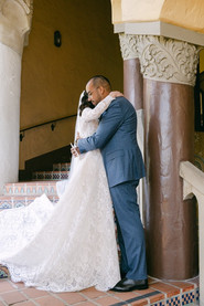 Bride and groom hugging.