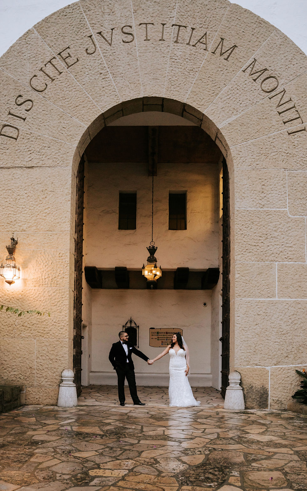 Close-up view of a wedding bouquet resting on a courthouse bench