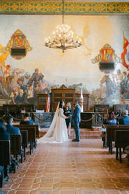 Bride and groom during ceremony in the hall of records.
