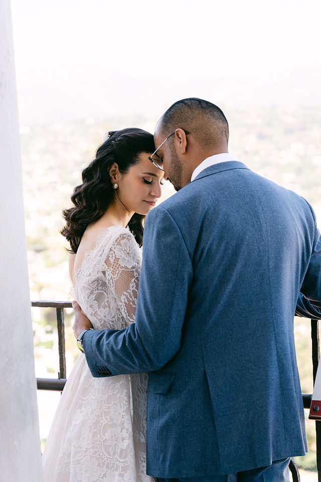 Bride & groom in embrace.
