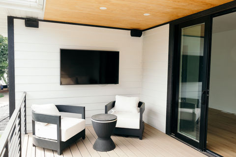 Transitional custom home deck with tv entertainment