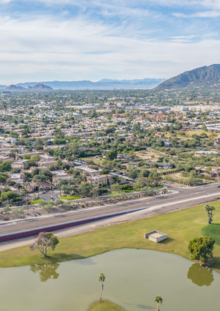 Aerial drone photo of Phoenix community park and amenities, real estate listing visuals for AZ agents
High-altitude drone shot of Scottsdale neighborhood schools and shopping, vibrant Arizona community media