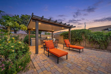 Twilight patio with pergola and lounge chairs in Gilbert, AZ