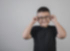 Young boy trying on glasses