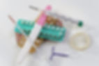 condoms and birth control pills on a white background.jpg