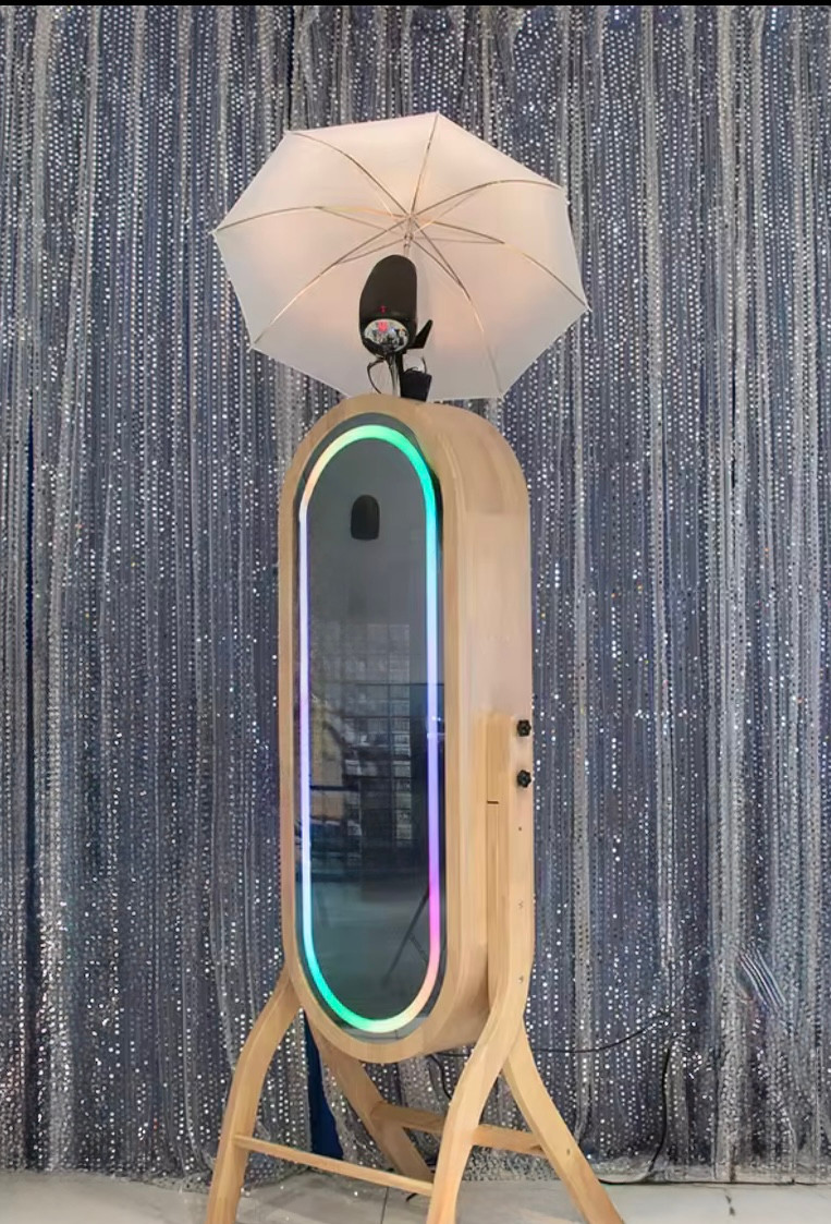 Eye-level view of a sleek photo booth setup with elegant lighting