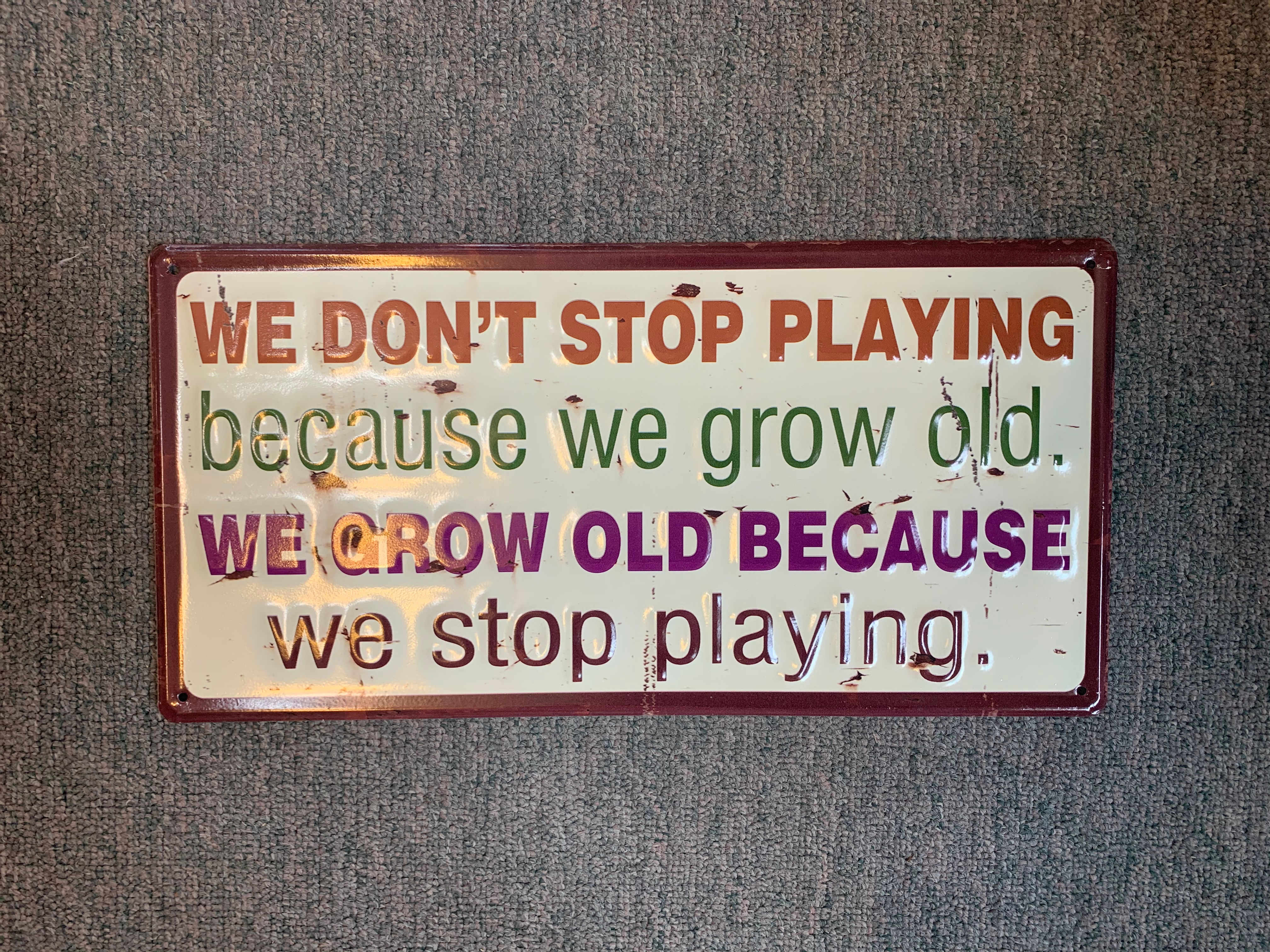 "We Don't Stop Playing" Sign