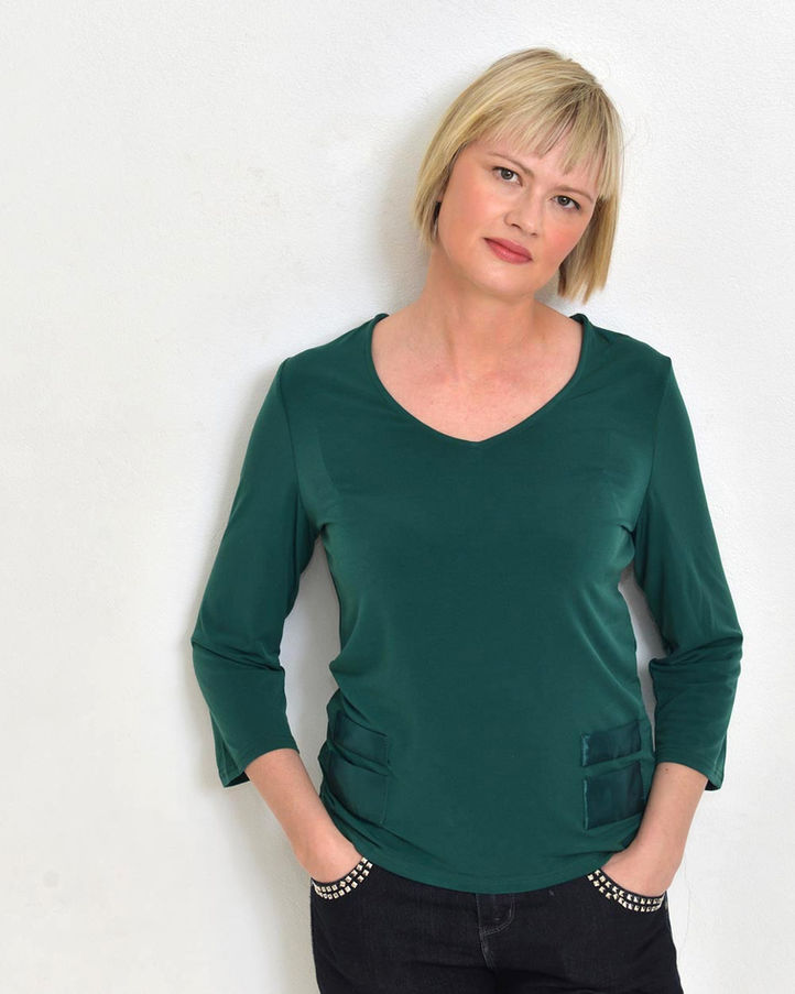 Blonde lady with green top