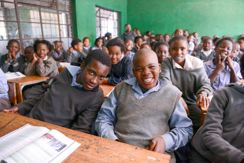 Smiling young students in a rural classroom