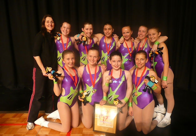 Activ8 athletes celebrating with medals and awards after a sport aerobics competition