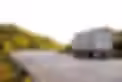 camion-arrivant-route-dans-paysage-rural-au-coucher-du-soleil_93200-4185.avif