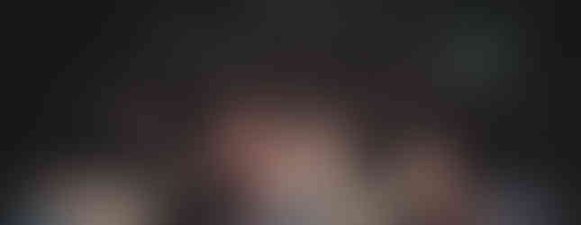 A group photo of Renesans posing with the cheering crowd at The Annex in Madison, WI from the stage