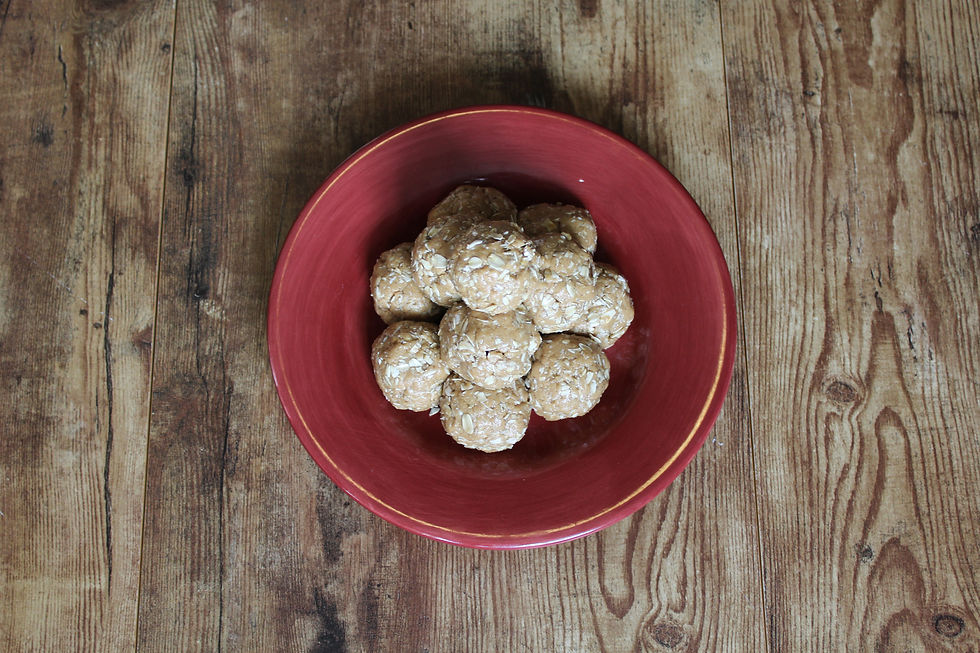 Power protein balls on red plate with dark background