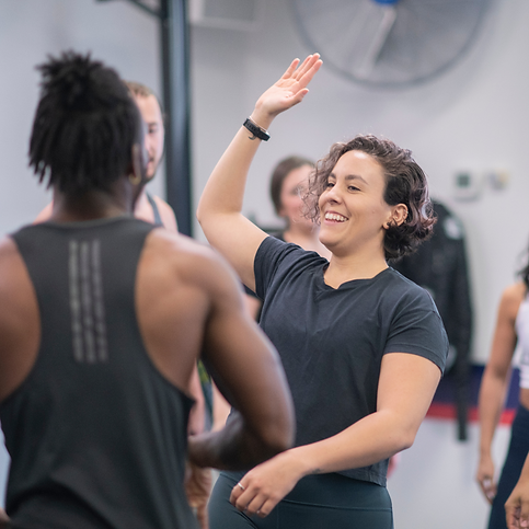 fitness professionals high fiving